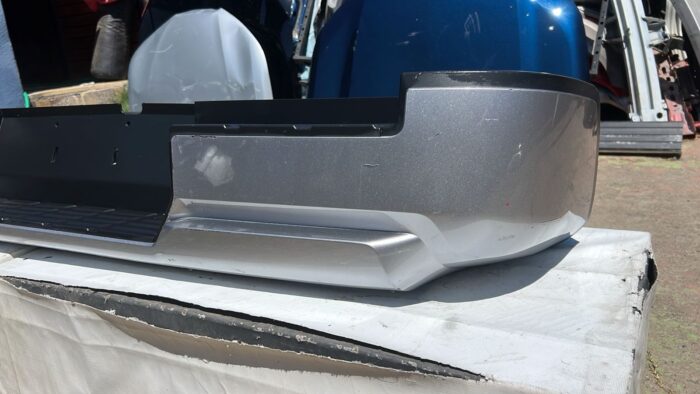 PARACHOQUE TRASERO MITSUBISHI L200 (25-26) - Imagen 6