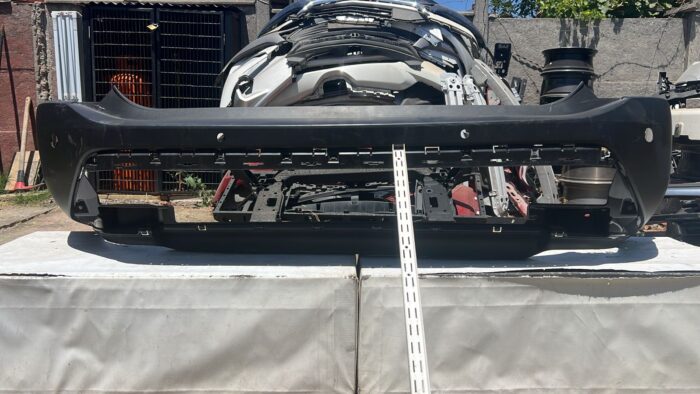 PARACHOQUE TRASERO NISSAN XTRAIL (23-25)